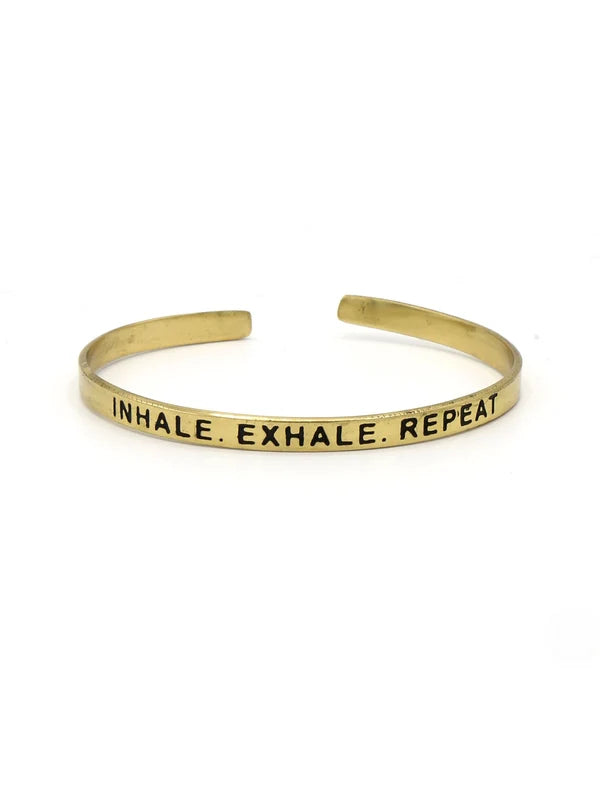 Fair Anita Breathe Cuff in brass, stamped Inhale. Exhale. Repeat.