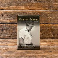 Front cover of Clarence Jordan: Spiritual Writings, featuring a black-and-white photograph of Clarence Jordan, displayed against a rustic wooden background.