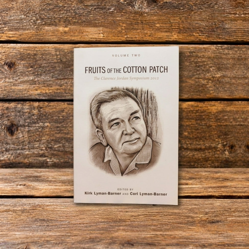 Front cover of Fruits of the Cotton Patch, Volume 2, with a pencil drawing of Clarence Jordan displayed against a rustic wooden background.