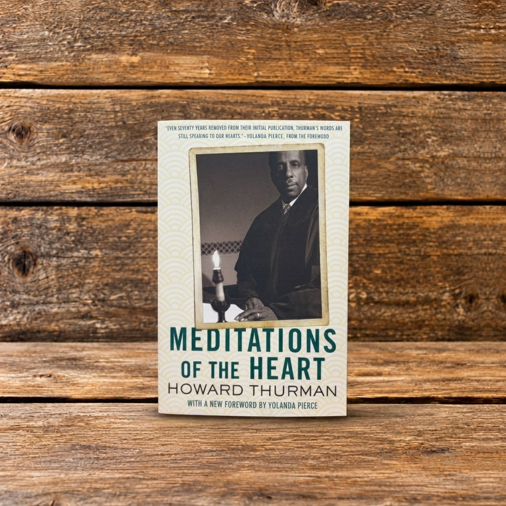 Front cover of Meditations of the Heart by Howard Thurman, featuring a black-and-white portrait of the author, photographed on a rustic wooden surface.