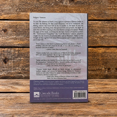 Back cover of The Substance of Faith and Other Cotton Patch Sermons by Clarence Jordan, featuring a book description, endorsements, and publisher information, displayed against a rustic wooden plank background.