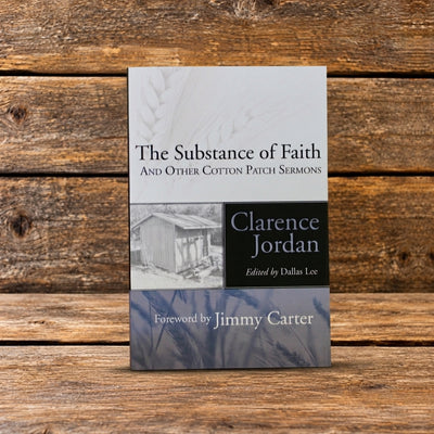 Front cover of The Substance of Faith and Other Cotton Patch Sermons by Clarence Jordan, displayed against a rustic wooden background.