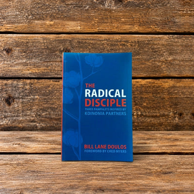 Front cover of The Radical Disciple by Bill Lane Doulos, featuring a blue book displayed against a rustic wooden background.